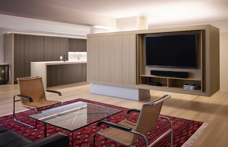 A living room with a glass table and chairs