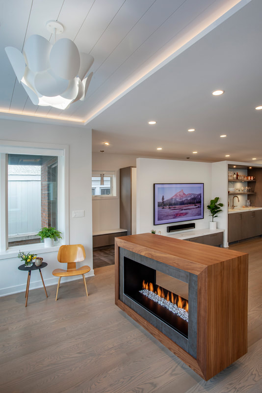 A living room with a fireplace and a tv
